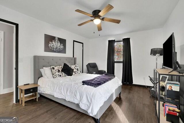 bedroom with dark wood-type flooring