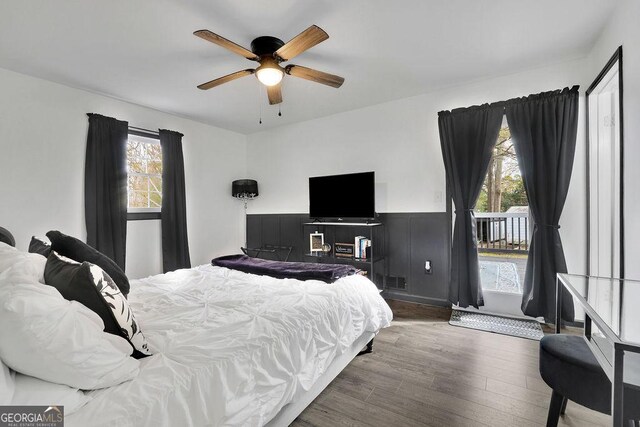 bedroom with ceiling fan and dark hardwood / wood-style flooring