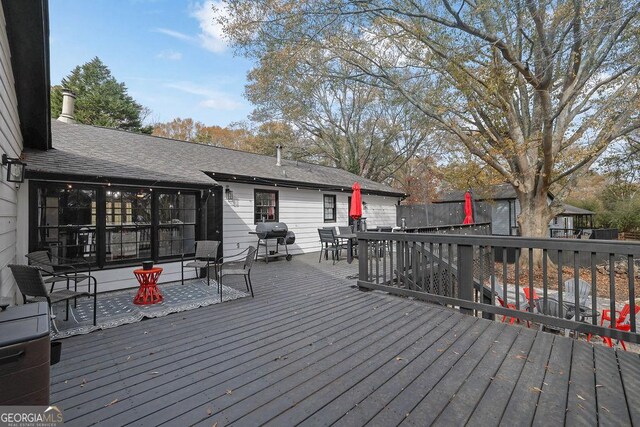 back of house featuring a deck, a yard, and a patio