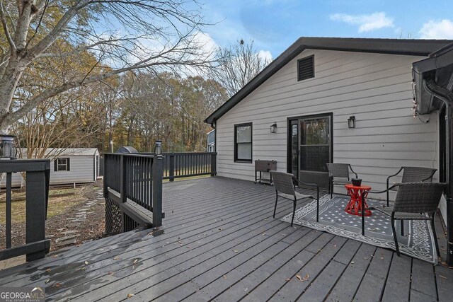 wooden deck with grilling area