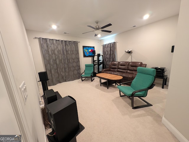 interior space featuring light carpet and ceiling fan