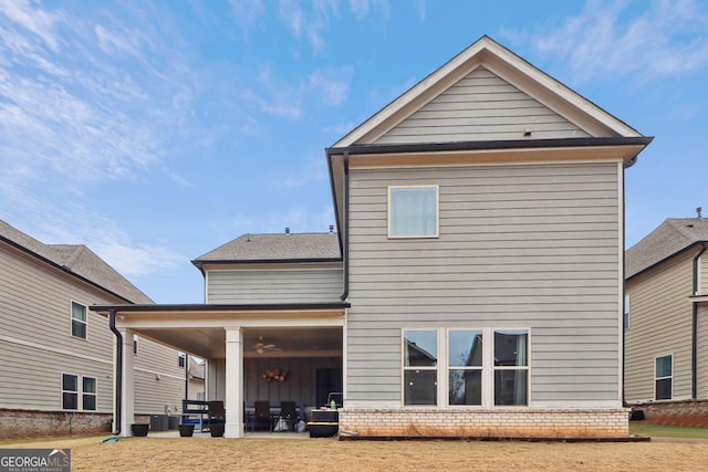 back of house featuring an outdoor living space, a patio, and central air condition unit