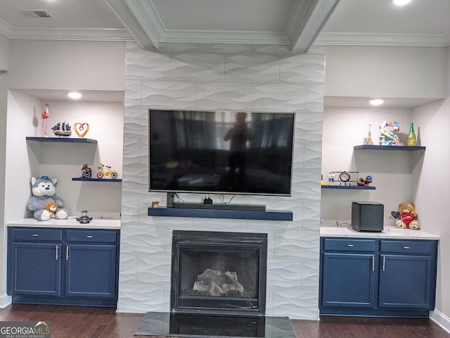 living room featuring a fireplace, dark hardwood / wood-style flooring, crown molding, and beamed ceiling