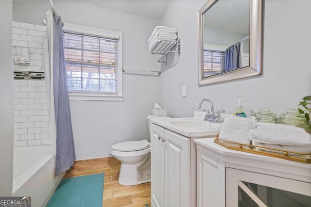 full bathroom featuring vanity, toilet, and shower / tub combo