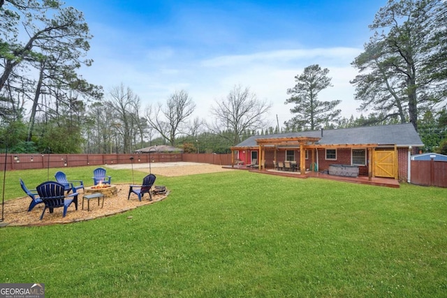 view of yard with a pergola and an outdoor fire pit