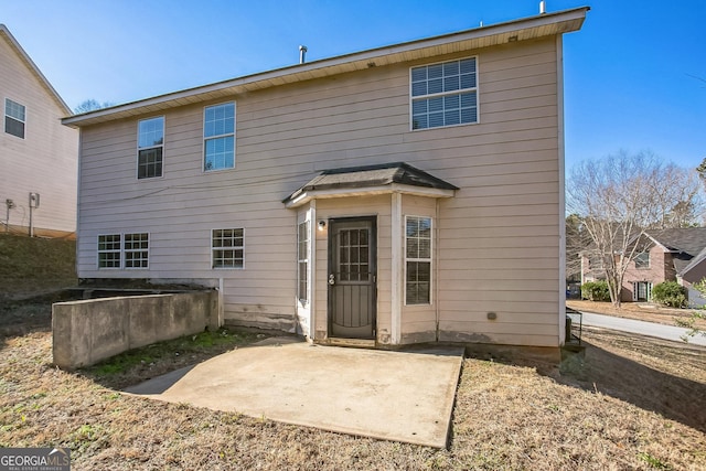 back of house with a patio