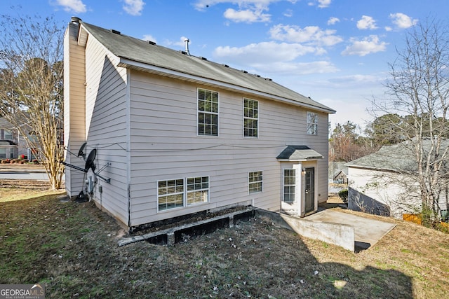 back of property with a patio area