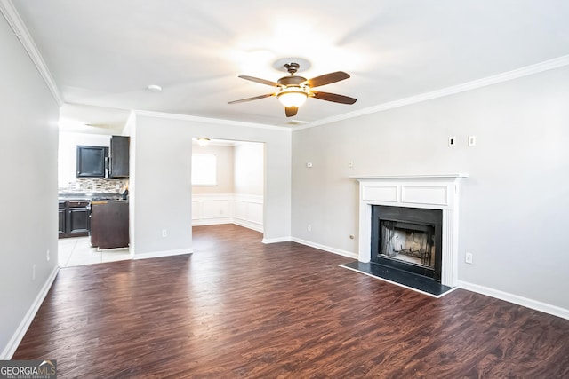 unfurnished living room with crown molding, dark hardwood / wood-style flooring, and ceiling fan