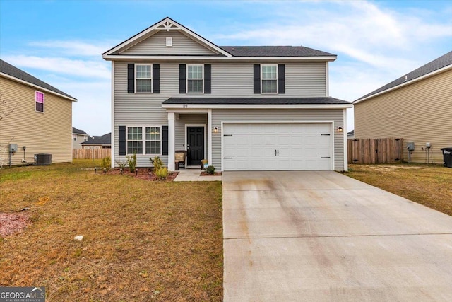 view of front property with central AC unit, a garage, and a front lawn