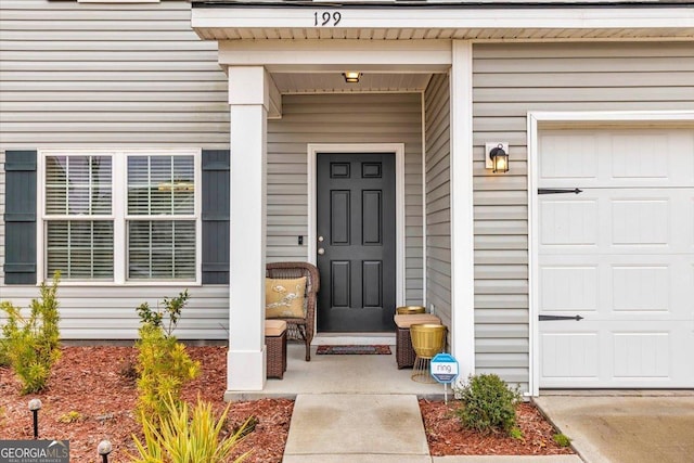 property entrance with a garage