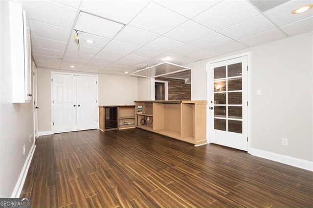 unfurnished living room featuring dark wood-type flooring