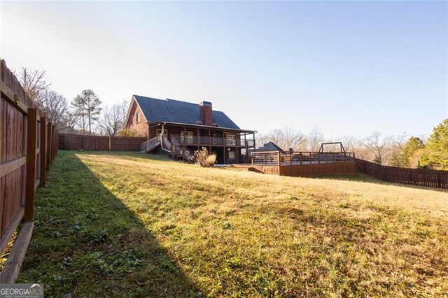 view of yard with a wooden deck