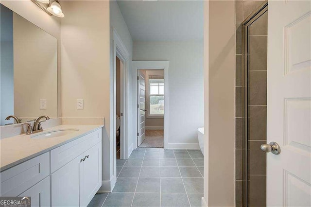 bathroom with tile patterned flooring, vanity, toilet, and a shower with door