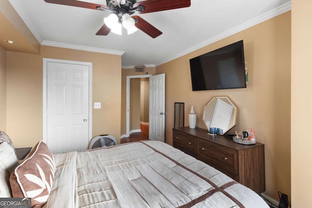 bedroom with ceiling fan and ornamental molding