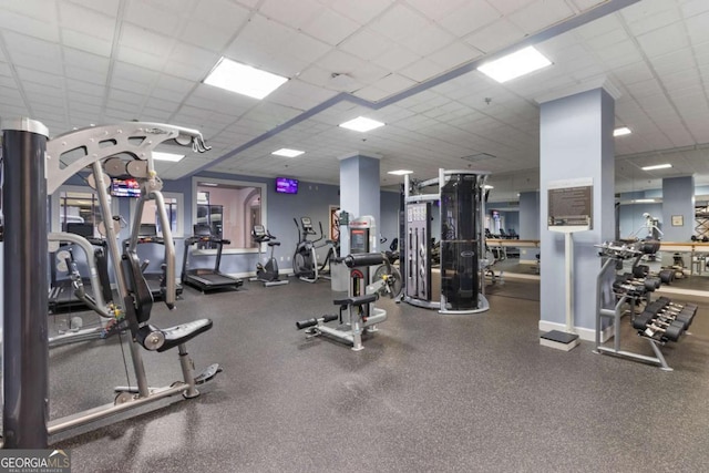 workout area with a drop ceiling