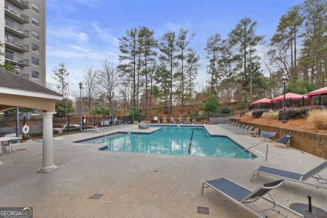 view of swimming pool featuring a patio