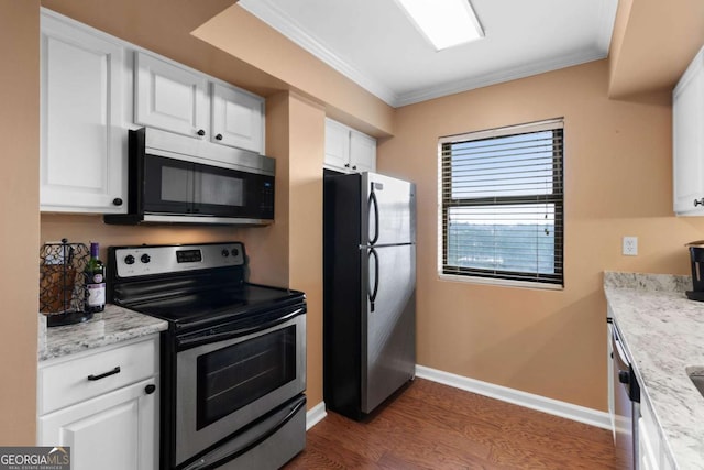 kitchen featuring light stone countertops, dark hardwood / wood-style flooring, ornamental molding, stainless steel appliances, and white cabinets