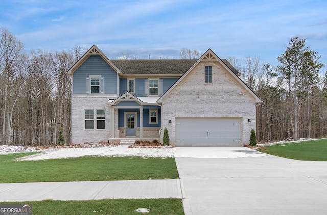 view of front facade with a garage and a front lawn