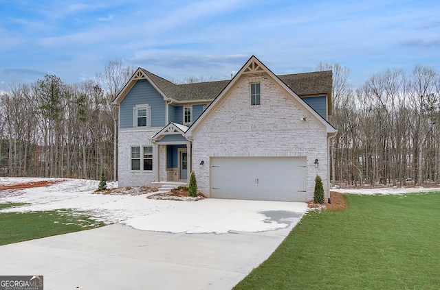 view of front of home featuring a garage and a yard