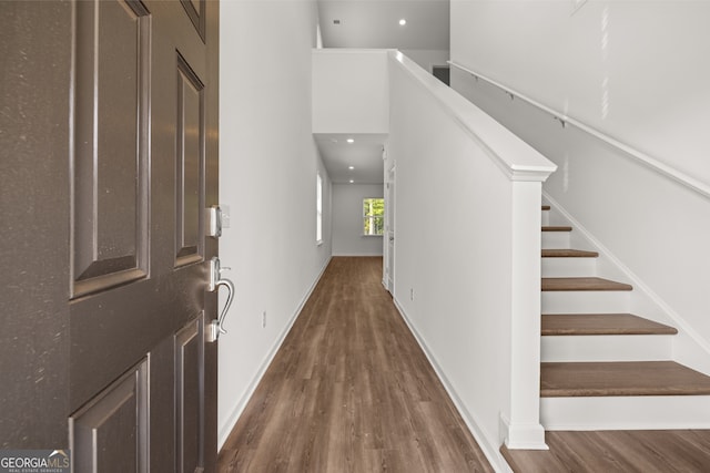 empty room with dark hardwood / wood-style flooring