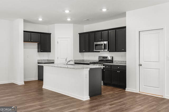 unfurnished living room featuring sink and dark wood-type flooring