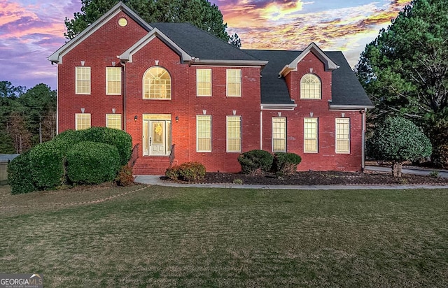 view of front of home featuring a yard