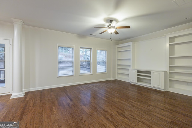 unfurnished living room featuring ornate columns, crown molding, built in features, and dark hardwood / wood-style floors