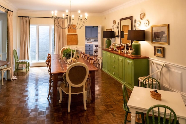 dining room with dark parquet flooring, crown molding, and a chandelier