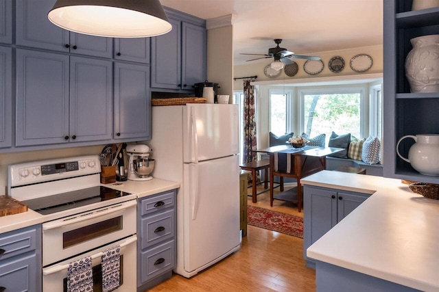 kitchen featuring ceiling fan, light hardwood / wood-style flooring, and white appliances