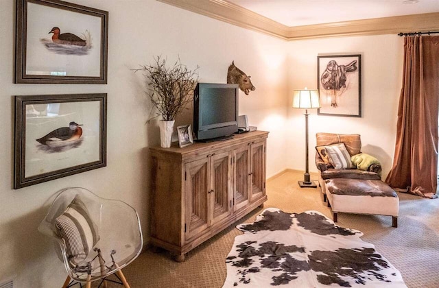 sitting room featuring light carpet and ornamental molding