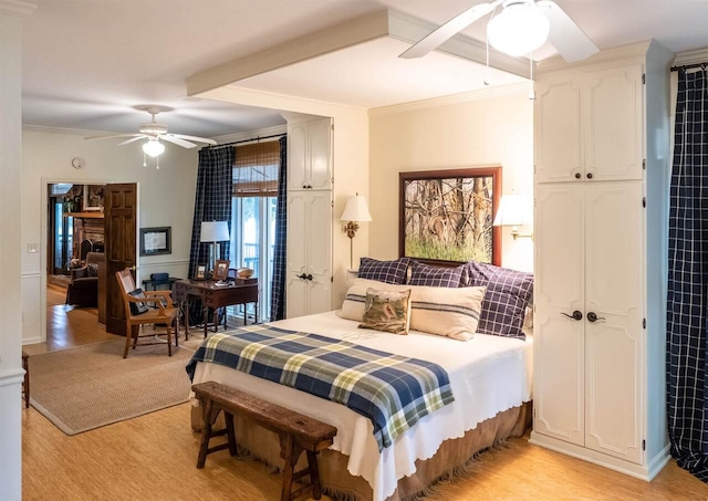 bedroom featuring a closet, ceiling fan, crown molding, and light wood-type flooring