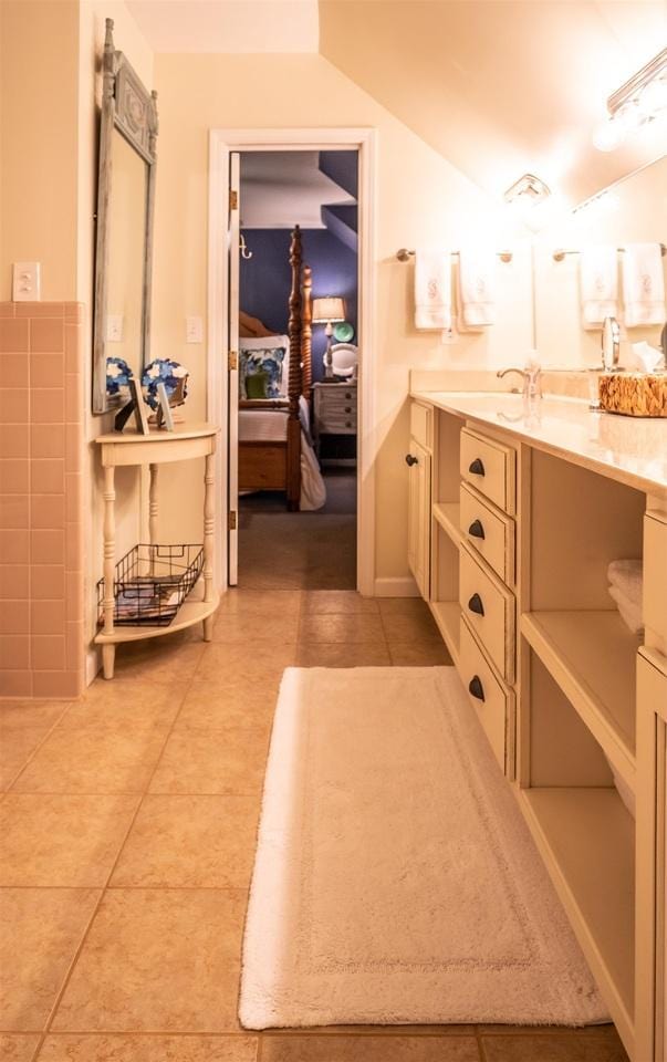 bathroom featuring tile patterned flooring and vanity