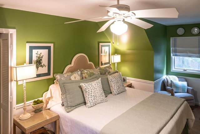 bedroom featuring ceiling fan and lofted ceiling