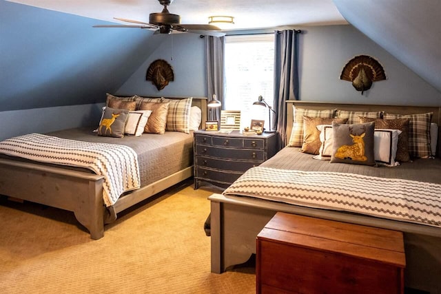 carpeted bedroom with ceiling fan and vaulted ceiling