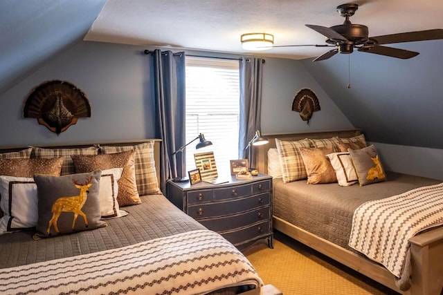 bedroom with ceiling fan, light carpet, and vaulted ceiling