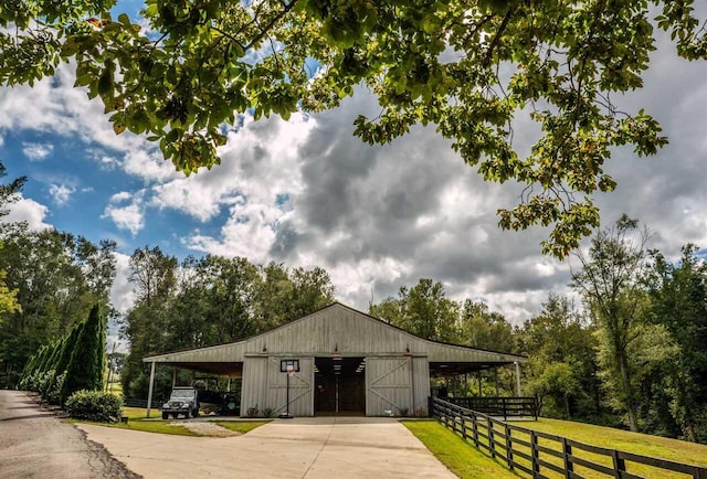 exterior space featuring a carport and a yard