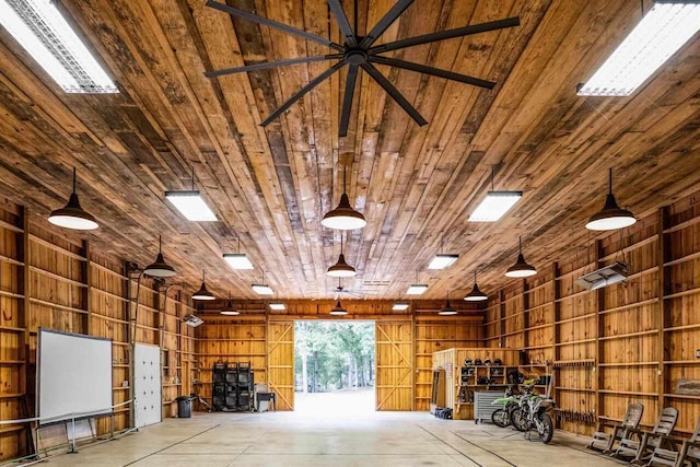 garage featuring wooden walls