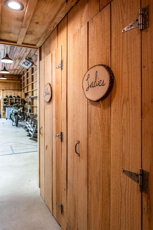 details featuring wood walls and wood ceiling