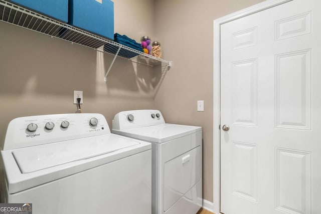 washroom with washer and dryer