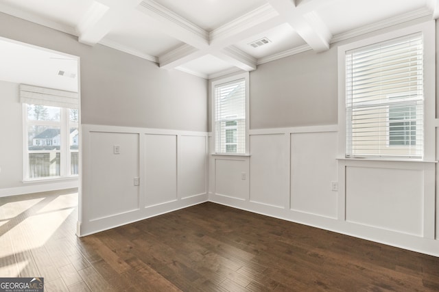 empty room with dark hardwood / wood-style floors, beam ceiling, ornamental molding, and coffered ceiling