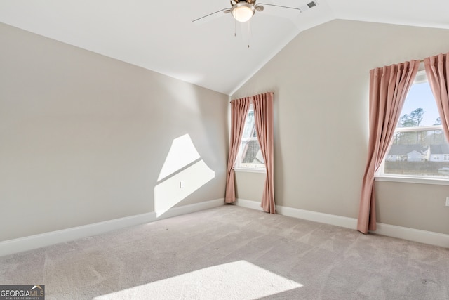 bonus room featuring plenty of natural light, ceiling fan, light carpet, and vaulted ceiling