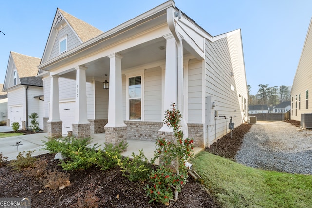 view of front of home featuring cooling unit and covered porch