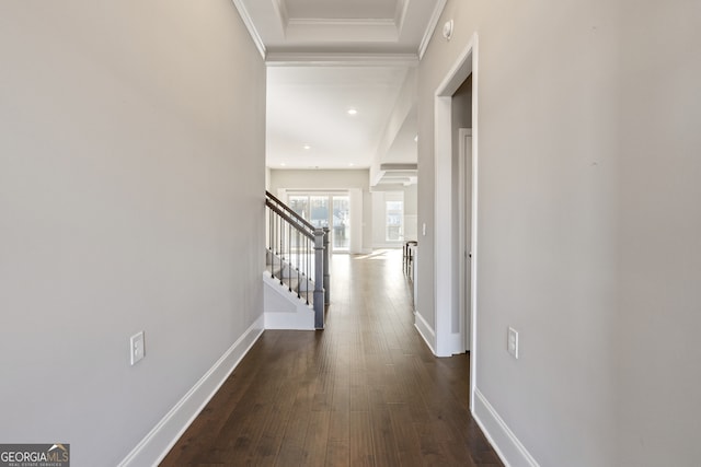 hallway featuring dark hardwood / wood-style floors and ornamental molding