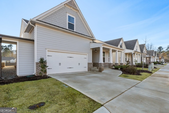 view of front of property featuring a garage and a front yard