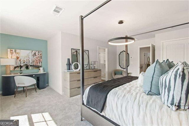 bedroom featuring light colored carpet