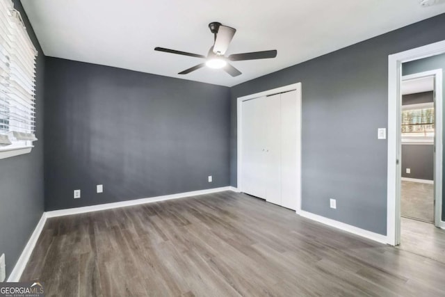 unfurnished bedroom with hardwood / wood-style flooring and ceiling fan