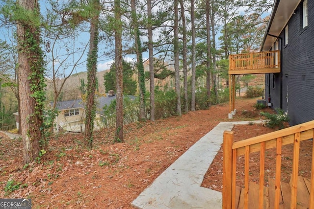 view of yard featuring a wooden deck