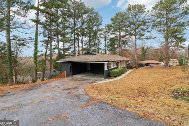 exterior space with a carport