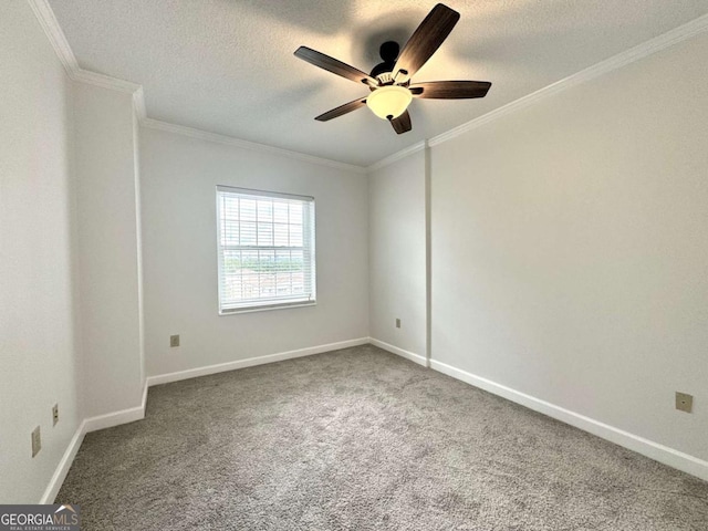 carpeted empty room featuring ceiling fan, ornamental molding, and a textured ceiling