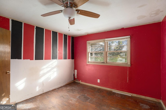 unfurnished room with ceiling fan and dark hardwood / wood-style flooring